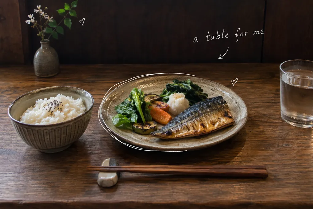 AI-generated single place setting at a wooden counter, with grilled fish, vegetables, rice and the handwritten words a table for me.